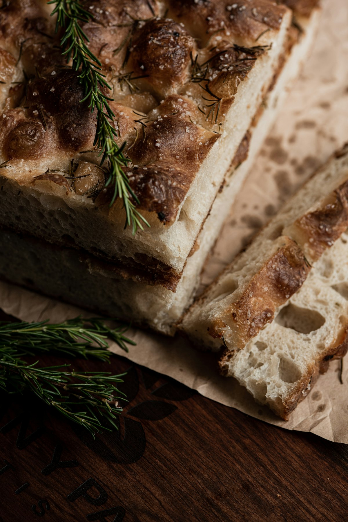 Slabs of rosemary focaccia showing an open crumb