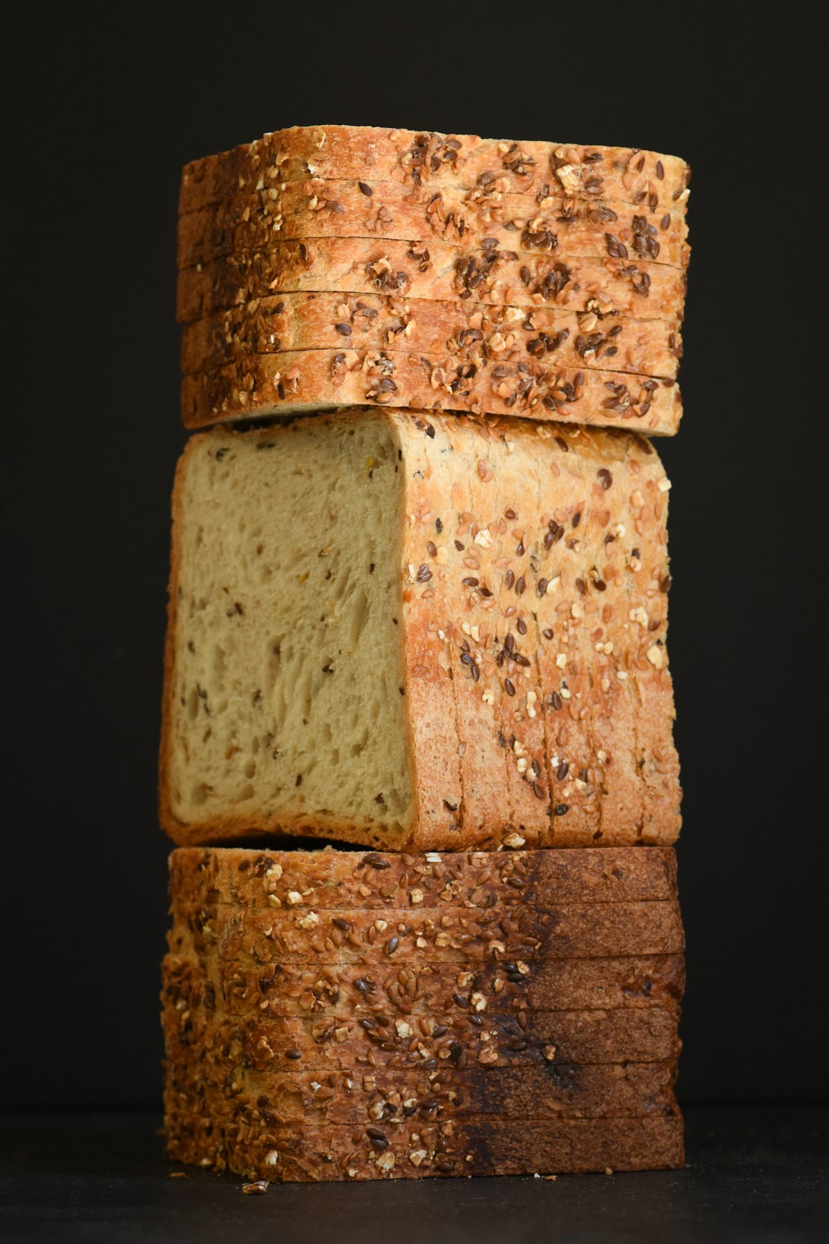 A seeded gluten free loaf, sliced